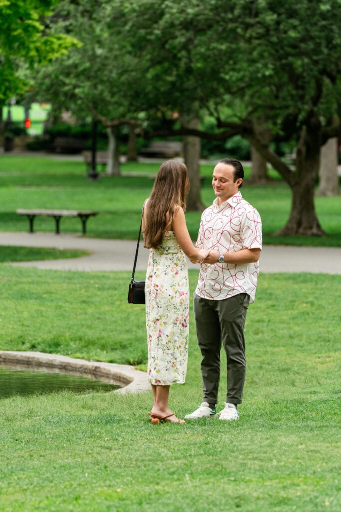 Candid surprise proposal photography at the Boston Public Garden