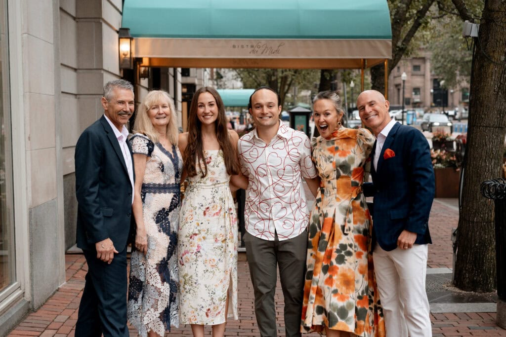 Event photography and engagement celebration at restaurant in Boston capturing genuine emotion