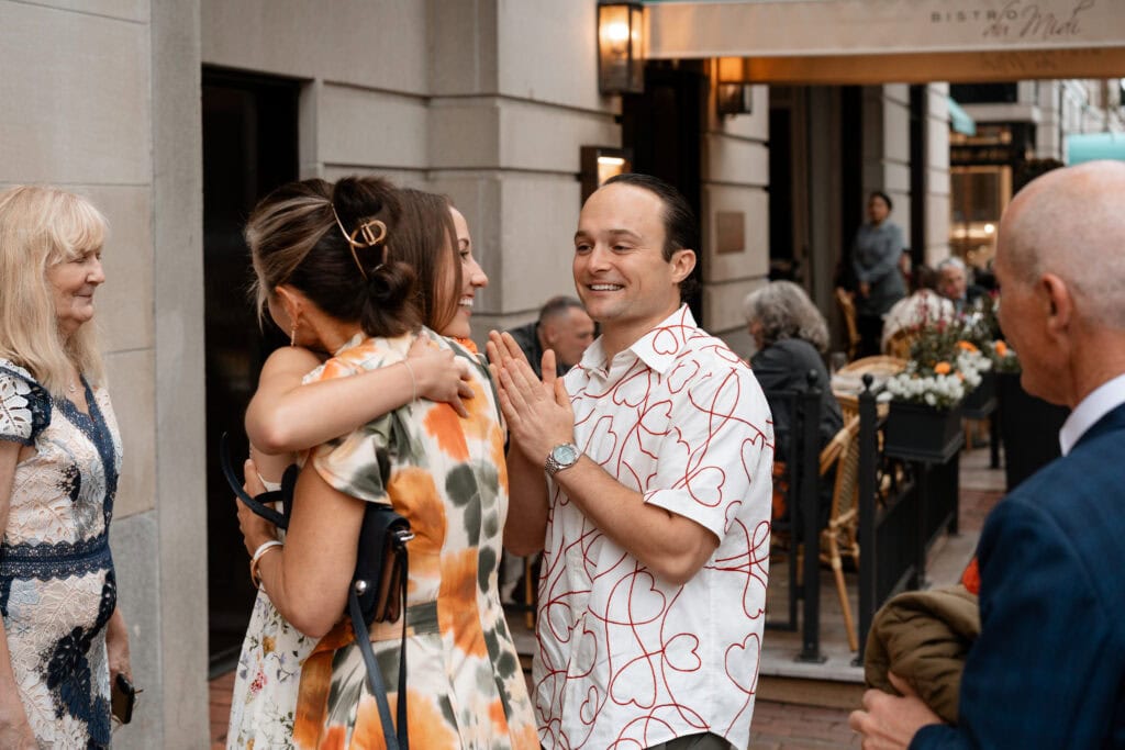Event photography and engagement celebration at restaurant in Boston capturing genuine emotion