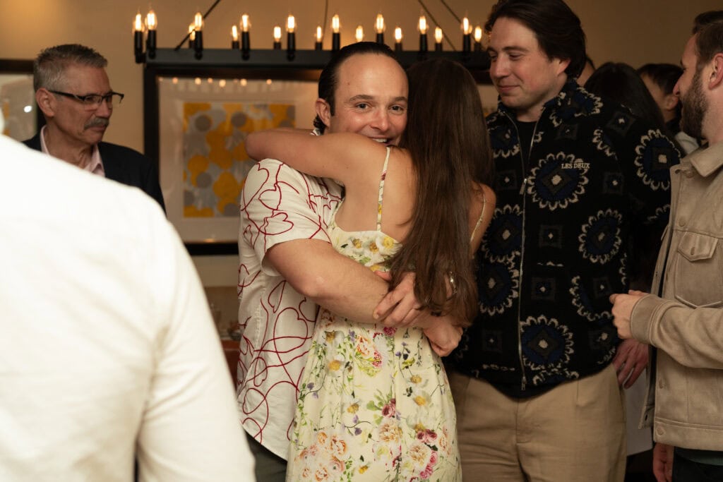 Event photography and engagement celebration at restaurant in Boston capturing genuine emotion