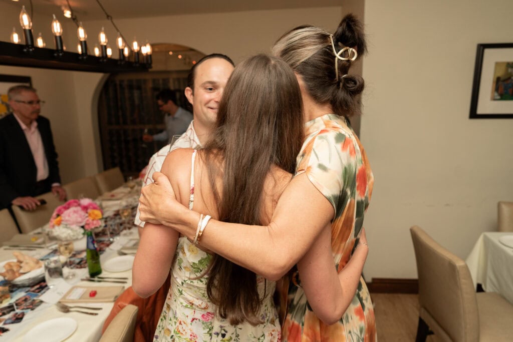 Event photography and engagement celebration at restaurant in Boston capturing genuine emotion