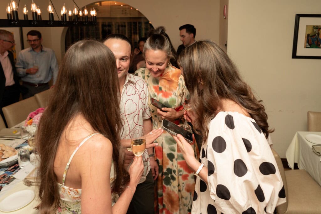 Event photography and engagement celebration at restaurant in Boston capturing genuine emotion